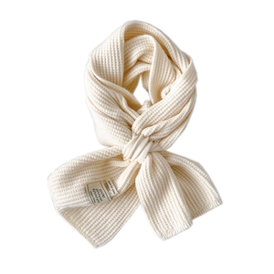 Creamy white knitted winter scarf for women and men featuring vertical rib texture
