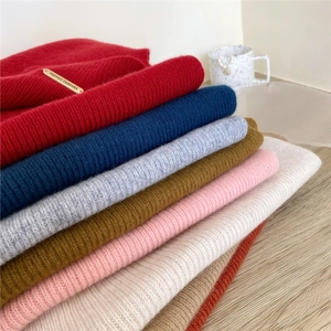 Solid color wool knitted scarf collection in diverse colors with textured rib design