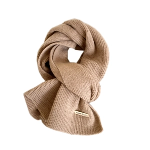 Minimalist camel ribbed knit wool scarf with a decorative gold logo bar on white background
