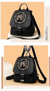 Close-up of black textured backpack featuring a shimmering sequined elephant motif
