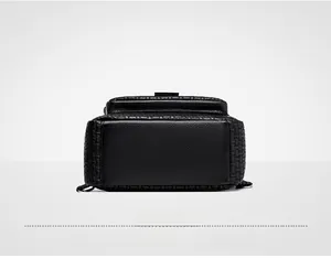 Detail view of the black elephant pattern backpack base with woven texture and D-rings