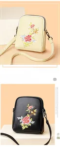 Close-up of floral embroidery on a double-layer PU leather crossbody mobile phone bag