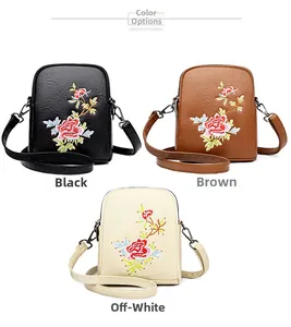 Detailed view of small crossbody phone bags with rose embroidery in black, brown and beige