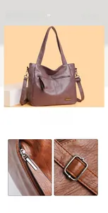 Close-up of litchi grain leather texture and high-quality metal zipper on tote bag