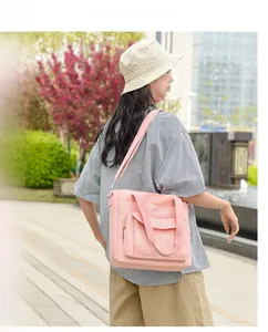 Outdoor model show of a large pink nylon tote bag with adjustable shoulder straps