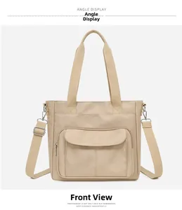Front view of a minimalist beige nylon tote bag with large pocket and adjustable strap