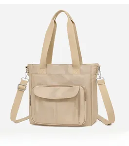 Side view of nylon tote bag with front flap pocket and adjustable shoulder strap