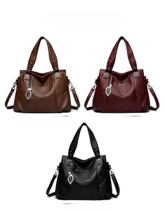Drei große Handtaschen aus Leder in Braun Rot und Schwarz für Damen im Überblick
