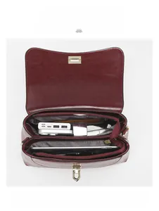 Detailed internal view of vintage burgundy shoulder bag showing large capacity for iPad