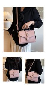 Pink lychee texture handbag with top handle and adjustable strap in a modern setting