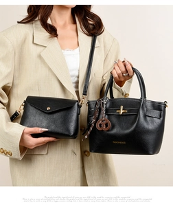 Chic black tote and crossbody bag set with contrast stitching on a beige suit model