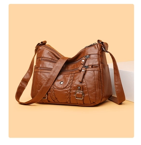 Sac bandoulière vintage en similicuir marron avec poches zippées et détails tressés