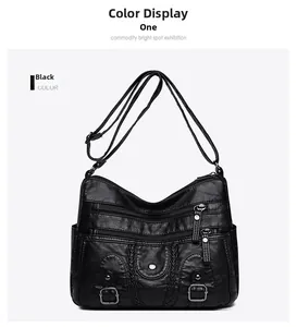 Détail du sac bandoulière en similicuir noir lavé avec plusieurs zips et poches latérales