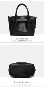 Detail view of the black leather handbag back with dual handles and wide bottom structure