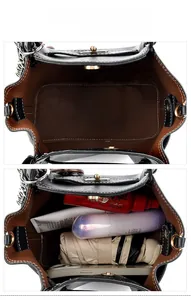 Internal display of black tote bag showing storage capacity for umbrella and cosmetics