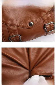 Detail of brown litchi pattern leather bag showing metal buckle and smooth zipper