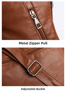 Detail of silver hardware zipper pull and adjustable buckle on brown leather crossbody bag
