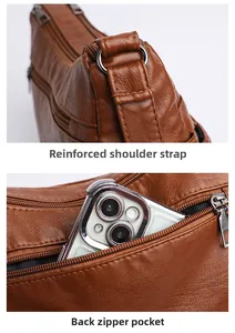 Detail of dark brown leather bag showing reinforced strap ring and rear zipper pocket