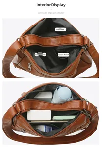 Vue macro de l'intérieur du sac en cuir marron avec compartiments et poche zippée