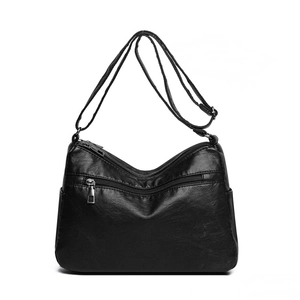 Versatile black PU leather crossbody bag for women with multi-pocket design and adjustable strap