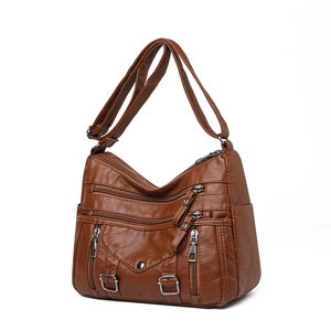 Brown washed PU leather crossbody bag with multi-zipper pockets and adjustable strap