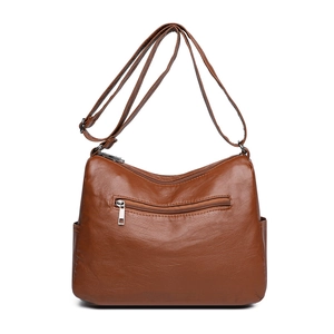 Minimalist dark brown faux leather crossbody bag with multiple zip compartments and strap