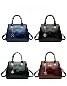Color options of glossy crocodile-embossed satchel bags with golden kangaroo charms
