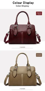 Detail view of burgundy and khaki tote bags featuring pleated texture and gold hardware