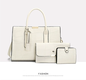 Three-piece beige cream tote bag set featuring embossed crocodile texture and gold hardware