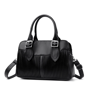 Black pebbled leather tote bag with pleated front, silver hardware and shoulder strap