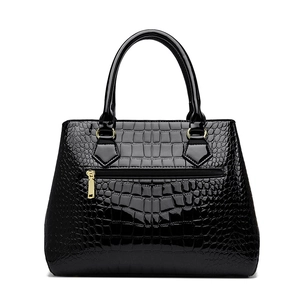 Classic black crocodile pattern patent leather handbag with gold metal zipper details