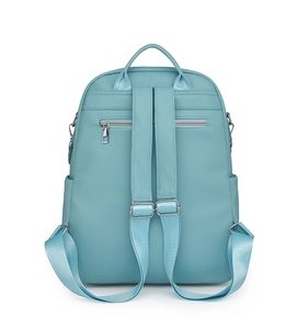 Detail of light blue pebble leather backpack featuring silver hardware and adjustable straps