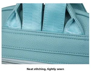 Detailed macro of tight stitching on light blue lychee pattern leather backpack