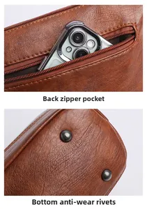 Detail der braunen Ledertasche mit Reißverschluss hinten und Bodennieten aus Metall
