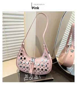 Detail of pink hobo bag featuring silver rivets on matte leather with shoulder strap