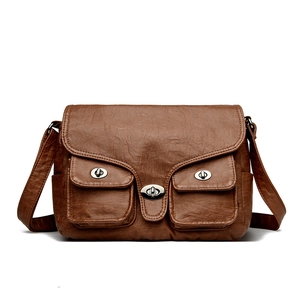 Vintage brown baguette bag with multiple utility pockets and silver metal turn-lock hardware