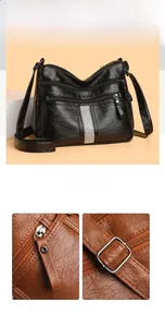 Detail of multi-zippered soft leather crossbody bags in black and brown textured finish