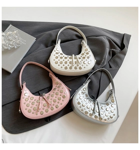 Three trendy hobo bags in silver, pink, and white featuring stylish metal rivet decorations