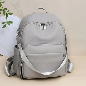 Minimalist dark gray PU leather backpack with lychee texture and silver zippers