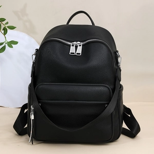 Minimalist black pebble leather backpack with large capacity and silver hardware