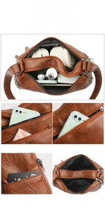 Detailed view of brown PU leather shoulder bag interior showing high storage capacity