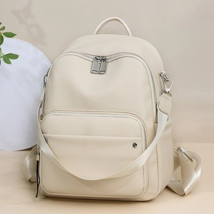 Minimalist cream white leather backpack with multiple zipper pockets for women traveling