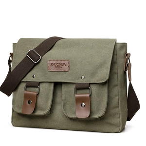 Dark green canvas crossbody messenger bag with leather accents and adjustable strap