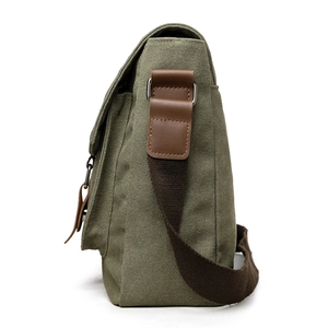 Olive green canvas messenger bag with brown leather accents and adjustable shoulder strap