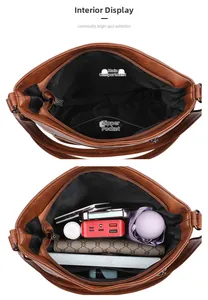 Interior detail of retro brown bucket bag showing large capacity and zipper pocket