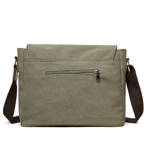 Green canvas crossbody messenger bag with back zipper pocket and brown strap