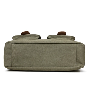 Olive green canvas crossbody bag with reinforced stitching and leather buckle accents