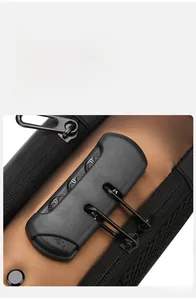 Detail of the three-digit TSA security lock on a brown motorcycle crossbody chest bag