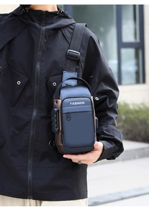 Close-up of anti-theft combination lock and side zipper on a blue men's chest bag