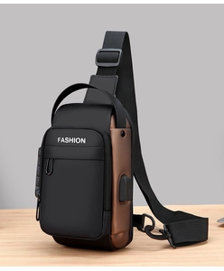 Close-up of anti-theft combination lock and USB charging port on motorcycle chest bag